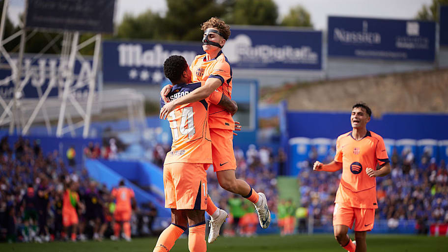 Barcelona players celebrate scoring vs. Getafe