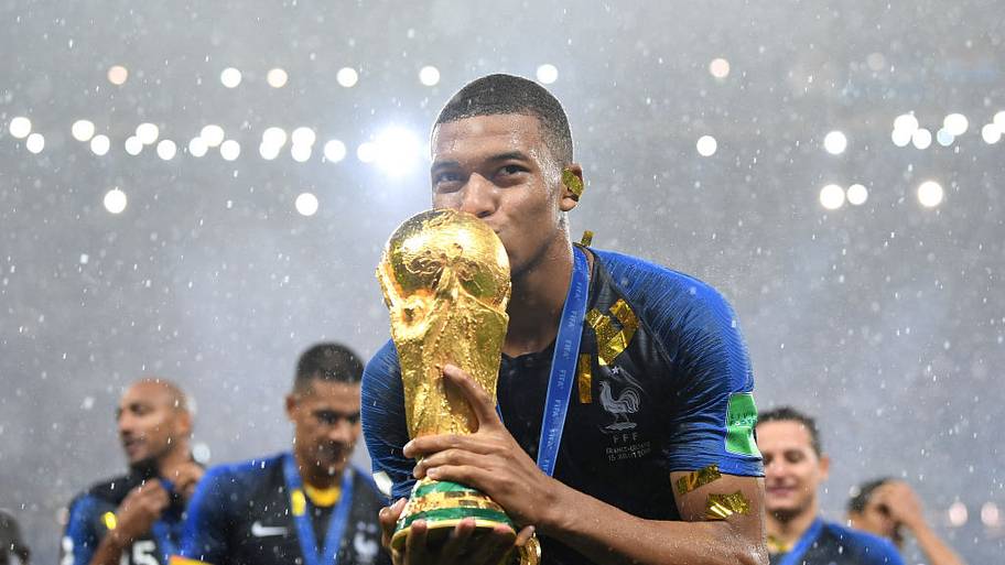 Kylian Mbappe with World Cup trophy