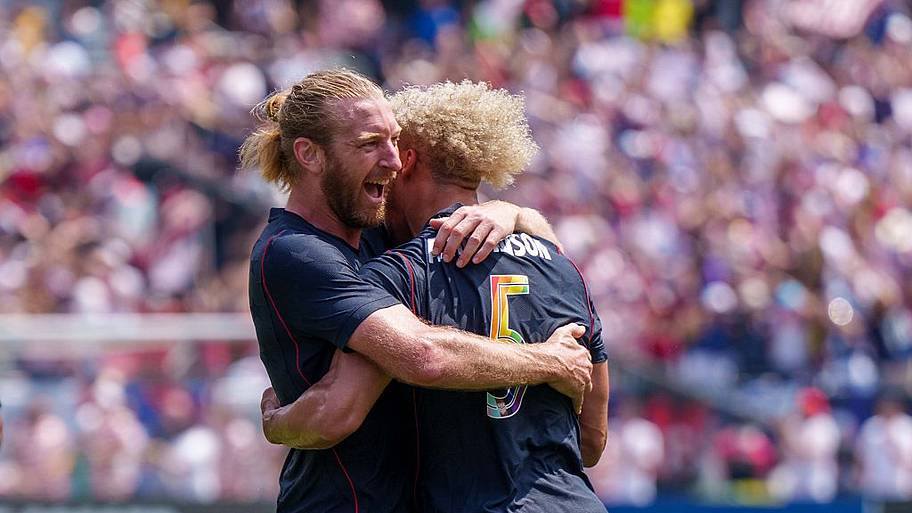 Tim Ream hugging Robinson