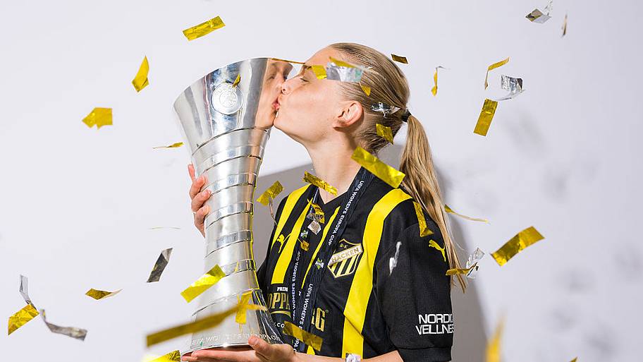 Stine Sandbech of BK Hacken FF kisses the UEFA Women's Europa Cup trophy.