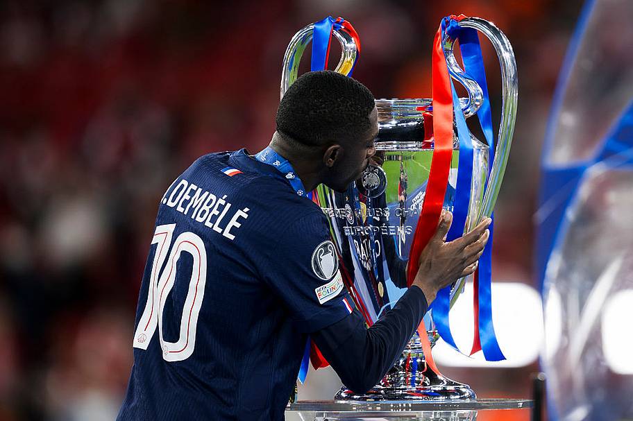Ousmane Dembélé with the Champions League trophy
