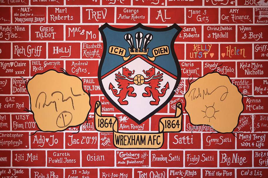 The autographs of Wrexham owners and Hollywood actors Ryan Reynolds and Rob McElhenney are seen on the wall of The Turf pub.