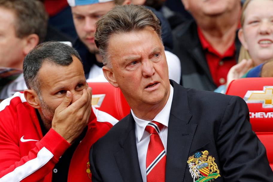 Ryan Giggs whispers to Louis van Gaal