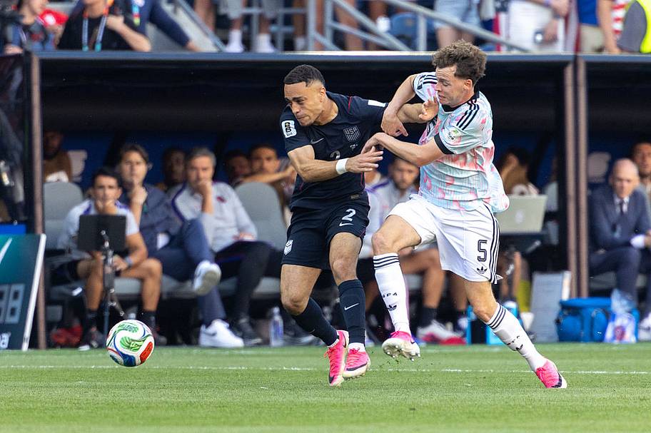 Sergiño Dest #2 of the United States and Maxim De Cuyper #5 of Belgium vie for the ball during the FIFA World Cup.