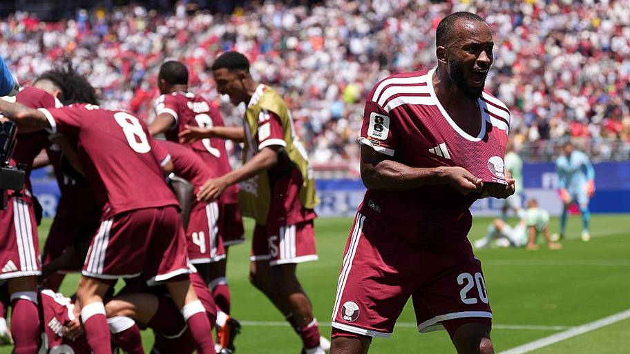 Qatar players celebrate