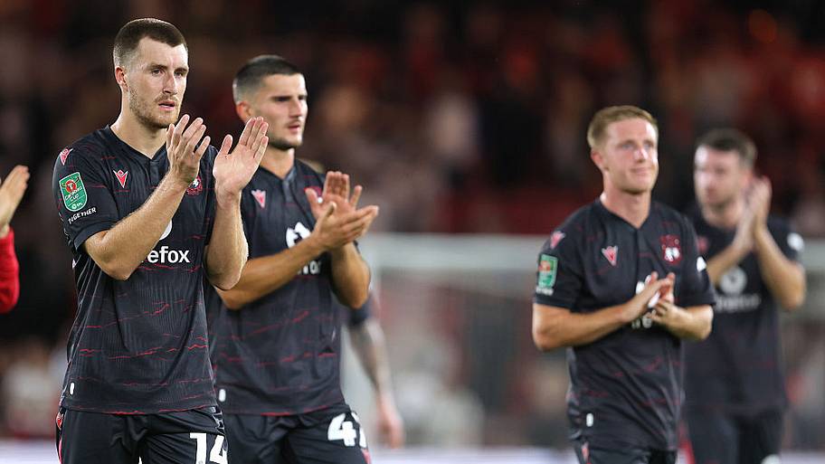 Wrexham players applaud the fans following the Carabao Cup First Round match.