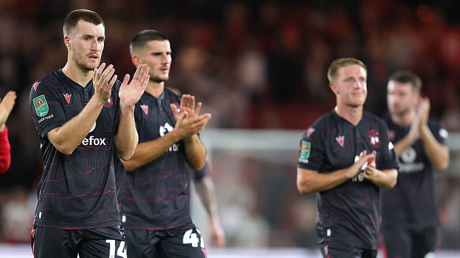 Wrexham players applaud the fans following the Carabao Cup First Round match.