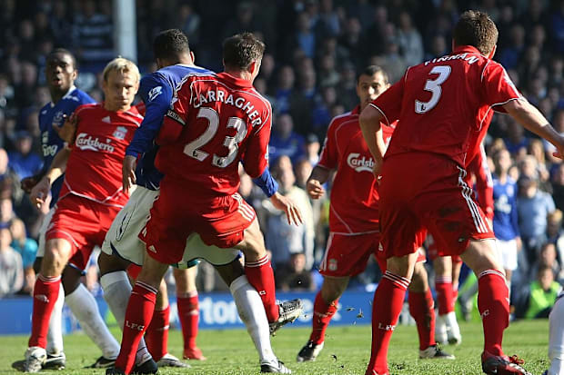 Joleon Lescott is fouled by Jamie Carragher