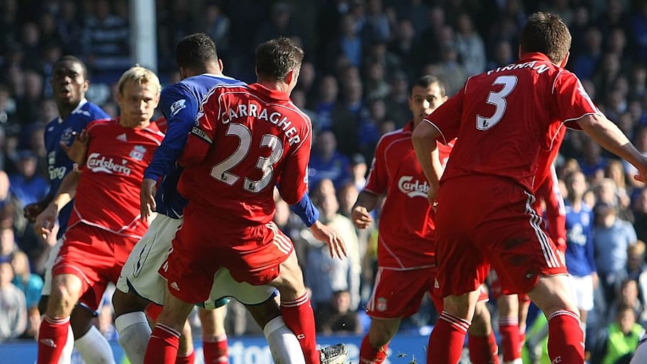 Joleon Lescott is fouled by Jamie Carragher