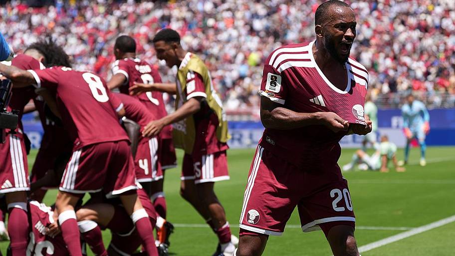 Qatar players celebrate