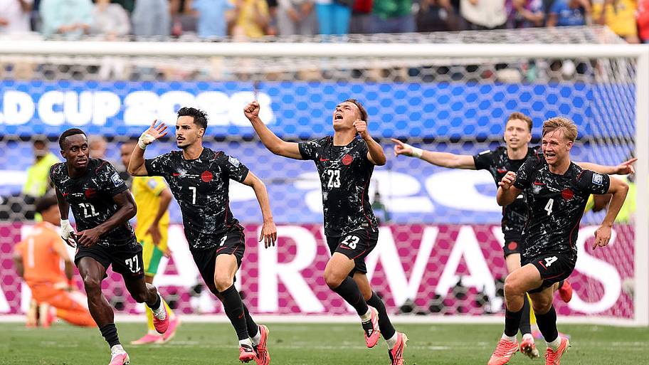 Canada celebrate scoring vs. South Africa