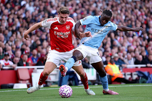 Viktor Gyokeres of Arsenal and Jeremy Doku of Manchester City Viktor Gyokeres of Arsenal and Jeremy Doku of Manchester City