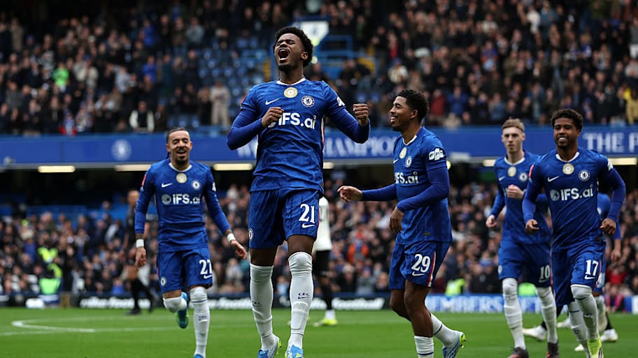 Jorrel Hato celebrates scoring for Chelsea