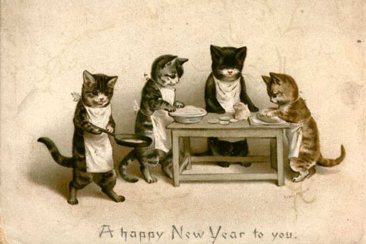 victorian new year card showing cats cooking