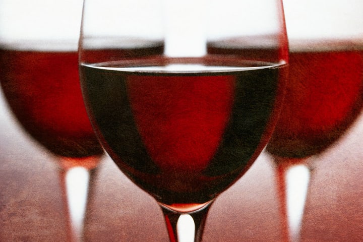 Three Stemmed Glasses of Red Wine