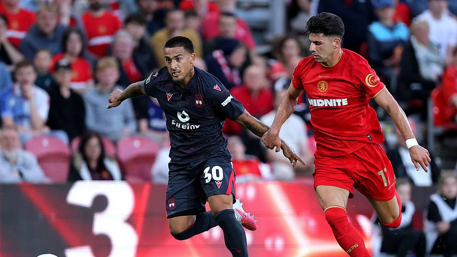 Wrexham's Daniel Imray (left) and Middlesbrough's Maximilian Arfsten battle for the ball during the Carabao Cup First Round.