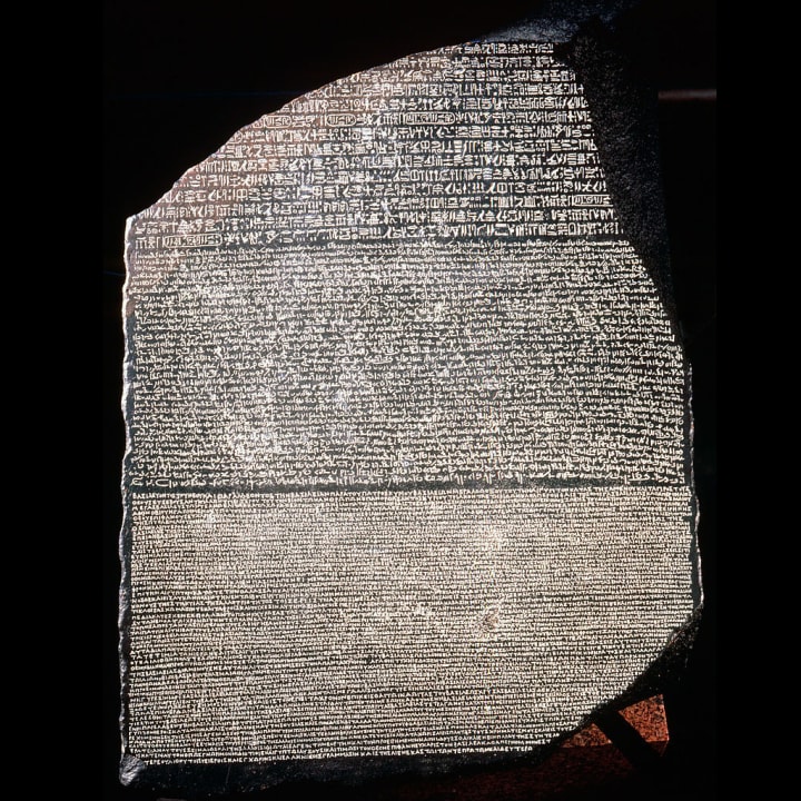 The Rosetta Stone, a basalt slab inscribed with a decree of the pharaoh Ptolemy V in three languages.