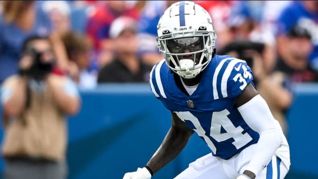 Colts cornerback Clay Fields III (blue jersey with white helmet/sleeves) waits to play defense after the snap. 