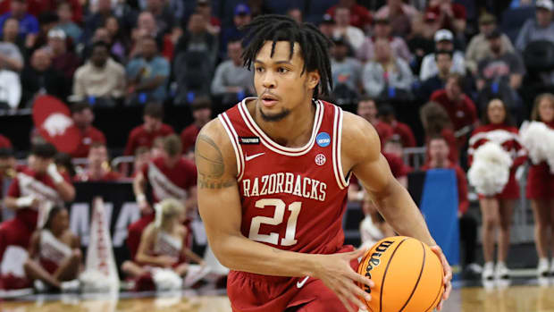 Razorbacks guard DJ Wagner drives for a layup against the Texas Tech Red Raiders in the Sweet 16