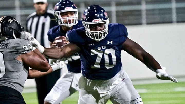 Denton Ryan offensive lineman Ty Haywood (70) delivers a block during a 2023 game.