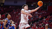 Nebraska basketball forward Braden Frager (5) shoots against Grand Valley State.