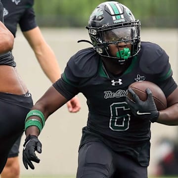 Prosper's Josh Martinez is shown carrying the ball in a game against Allen. Prosper beat Princeton in Week 10. 