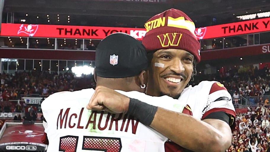 Washington Commanders quarterback Jayden Daniels hugs receiver Terry McLaurin after winning a playoff game. | Kim Klement Neitzel-Imagn Images