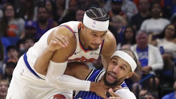 New York Knicks guard Josh Hart fouls Orlando Magic guard Jalen Suggs.