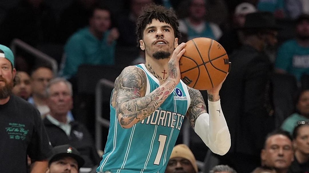 Nov 1, 2025; Charlotte, North Carolina, USA; Charlotte Hornets guard LaMelo Ball (1) shoots a three point shot against the Minnesota Timberwolves during the first quarter at Spectrum Center. Mandatory Credit: Jim Dedmon-Imagn Images