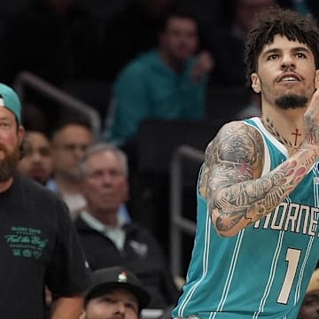 Nov 1, 2025; Charlotte, North Carolina, USA; Charlotte Hornets guard LaMelo Ball (1) shoots a three point shot against the Minnesota Timberwolves during the first quarter at Spectrum Center. Mandatory Credit: Jim Dedmon-Imagn Images