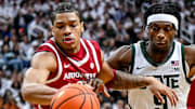 Arkansas' Darius Acuff Jr. makes a steal against Michigan State's Trey Fort during the first half on Saturday at the Breslin Center in East Lansing, Mich.