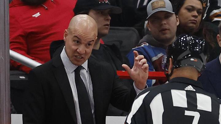 Feb 13, 2024; Washington, District of Columbia, USA; Washington Capitals head coach Spencer Carbery (L) talks with referee Garrett Rank (7) during a stoppage in play against the Colorado Avalanche in the third period at Capital One Arena. Mandatory Credit: Geoff Burke-Imagn Images