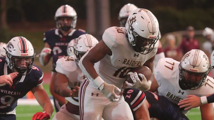 Riverdale player Lovensky Blanchard makes a run for big gain. The Estero High School Wildcats football team lost at home on their opening night against the Riverdale High School Raiders Friday night, August 23, 2024. Riverdale won with a final score of 42-14.