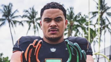 Seuseu Alofaituli posing during his official visit with the Miami Hurricanes.