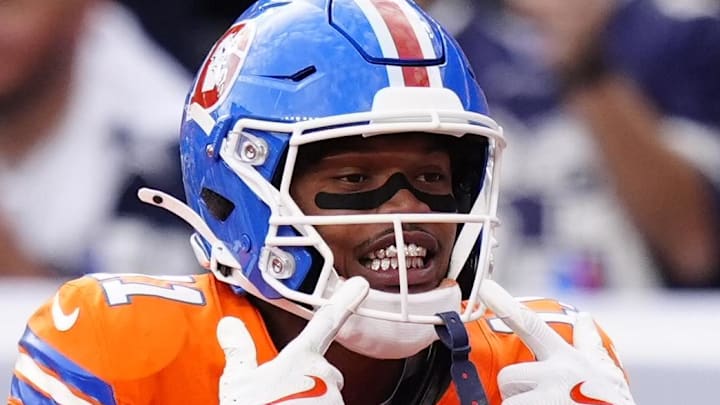 Oct 26, 2025; Denver, Colorado, USA;  Denver Broncos wide receiver Troy Franklin (11) celebrates after scoring a touchdown against the Dallas Cowboys in the fourth quarter at Empower Field at Mile High. Mandatory Credit: Ron Chenoy-Imagn Images