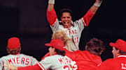 Text: world series /oct. 1990; barry larkin leaps in celebration after the reds sweep oakland to win the 1990 world series. cincinnati enquirer photo by gary landers. gl

Text World Series Oct 1990 Barry Larkin Leaps In Celebration After The Reds Sweep Oakland To Win The 1990 World Series Cincinnati Enquirer Photo By Gary Landers Gl