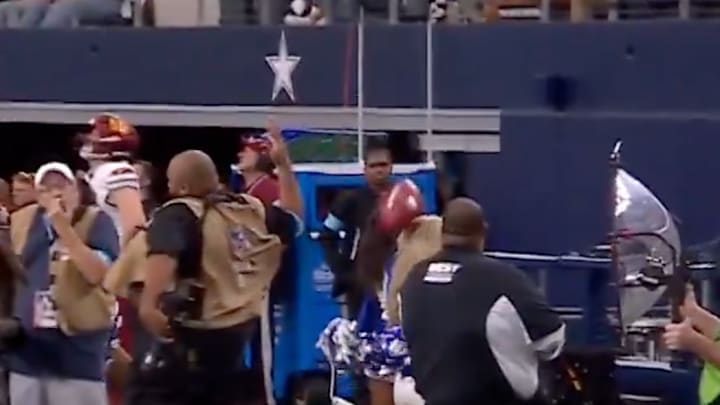 Cowboys cheerleader hit by football 