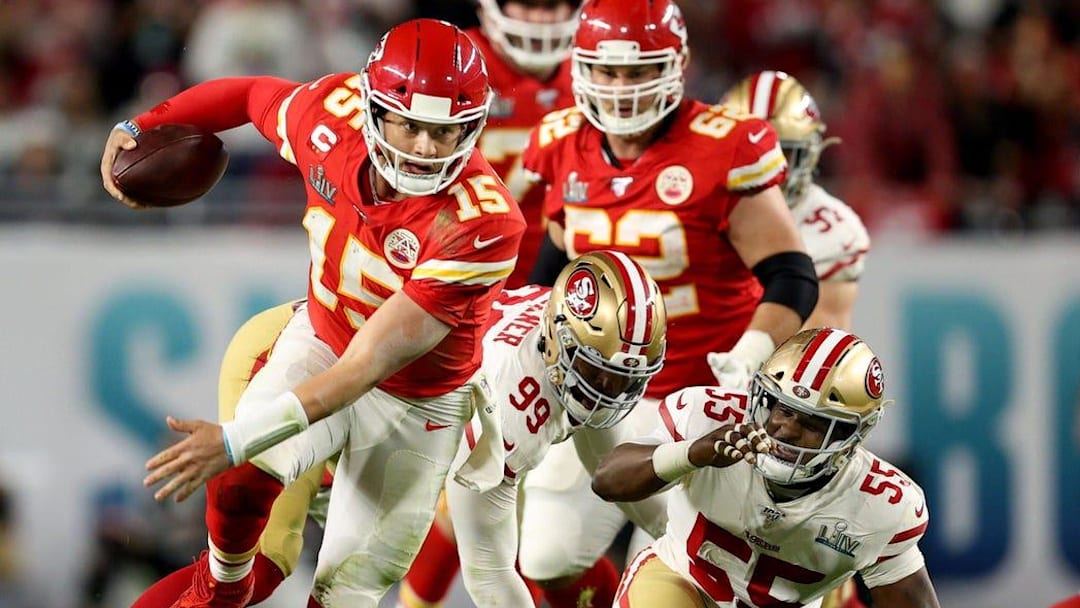 Kansas City Chiefs quarterback Patrick Mahomes breaks off a run after escaping from San Francisco 49ers defensive tackle DeForest Buckner and defensive end Dee Ford during the fourth quarter of Super Bowl LIV at Hard Rock Stadium in Miami Gardens, on Feb. 2, 2020.
