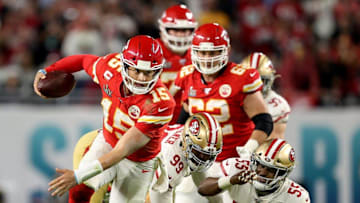 Kansas City Chiefs quarterback Patrick Mahomes breaks off a run after escaping from San Francisco 49ers defensive tackle DeForest Buckner and defensive end Dee Ford during the fourth quarter of Super Bowl LIV.