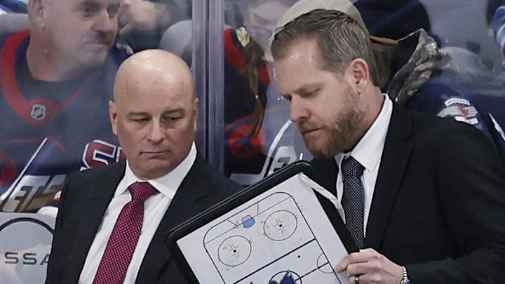 Apr 7, 2025; Winnipeg, Manitoba, CAN; St. Louis Blues head coach Jim Montgomery talks with St. Louis Blues assistant coach Steve Ott during a time out against the Winnipeg Jets in the third period at Canada Life Centre. Mandatory Credit: James Carey Lauder-Imagn Images