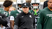 Michigan State's head coach Jonathan Smith, center, looks on from the sideline during the third quarter in the game against UCLA on Saturday, Oct. 11, 2025, at Spartan Stadium in East Lansing.