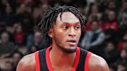 Toronto Raptors guard Immanuel Quickley controls the ball as Indiana Pacers forward Jeremiah Robinson-Earl.