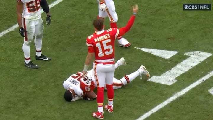 Mahomes calls for trainers after Garrett was injured. 