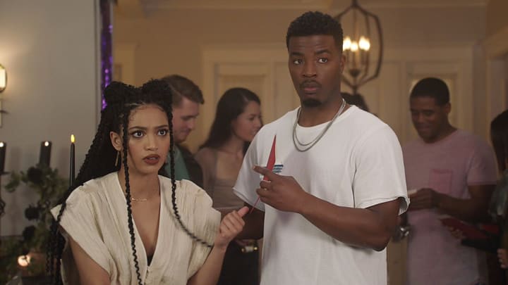 All American -- "Murder Was the Case” -- Image Number: ALA419fg_0026r.jpg -- Pictured (L-R): Samantha Logan as Olivia Baker and Daniel Ezra as Spencer James -- Photo: The CW -- (C) 2022 The CW Network, LLC. All Rights Reserved.