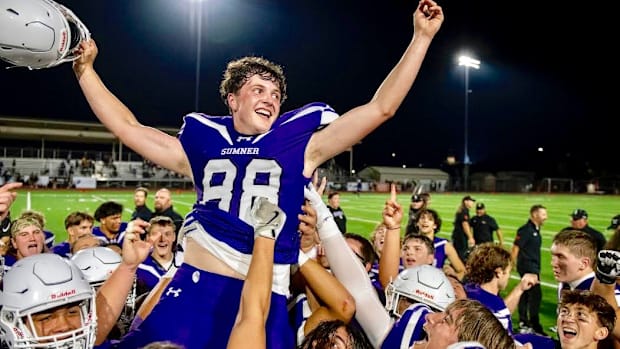 Sumner kicker Austin Ferencz is carried off the field after booting the game winning field goal in overtime in Spartans' wild