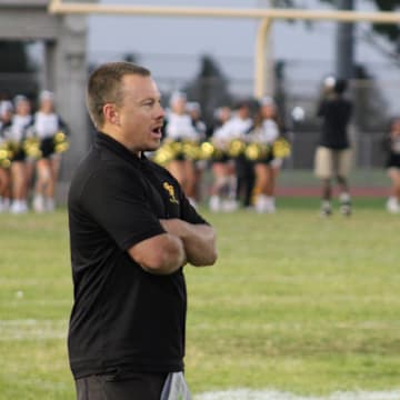 San Pedro football coach Corey Walsh talks to an official before his team takes on Garfield on Friday, Sept. 13, 2024.