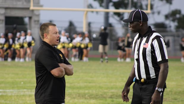 San Pedro football coach Corey Walsh talks to an official before his team takes on Garfield on Friday, Sept. 13, 2024.