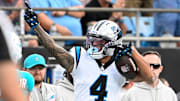 Oct 5, 2025; Charlotte, North Carolina, USA; Carolina Panthers wide receiver Tetairoa McMillan (4) signals first down in the second quarter at Bank of America Stadium. 
