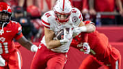 Nebraska tight end Luke Lindenmeyer gains yards in the season opener against Cincinnati.