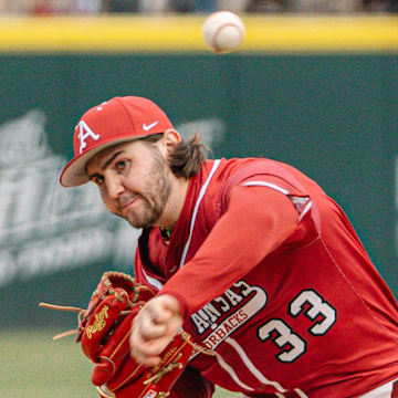 Arkansas Razorbacks pitcher Zach Root delivers a pitch against Washington State on Friday afternoon in the second game of a doubleheader.